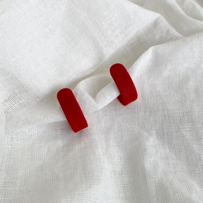 handmade, small, red hoop earring made from polymer clay