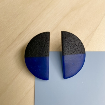 handmade half black, half blue half circle polymer clay earrings with stainless steel backs