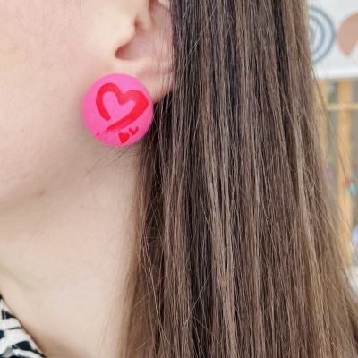 pink circle earrings with red hearts from polymer clay