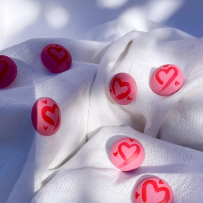 pink circle earrings with red hearts from polymer clay