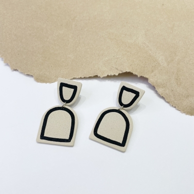  beige handmade arch shape polymer clay earrings with grey lines