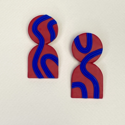 Handmade earrings in red tones and blue lines