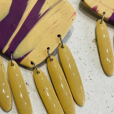 Handcrafted dangle polymer clay earrings light yellow and purple colour 