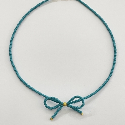 Handmade necklace from beads with bead bow