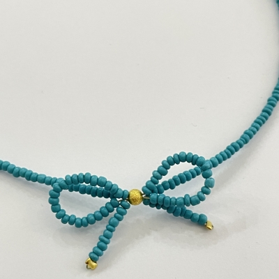 Handmade necklace from beads with bead bow