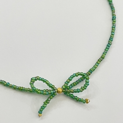 Handmade necklace from beads with bead bow