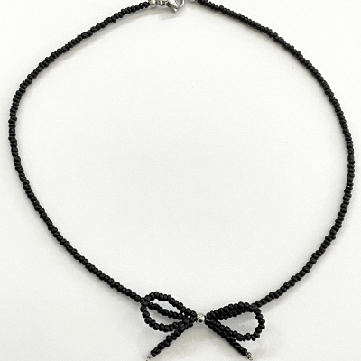 Handmade necklace from beads with bead bow