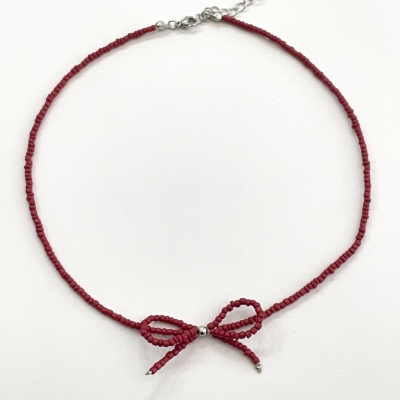 Handmade necklace from beads with bead bow