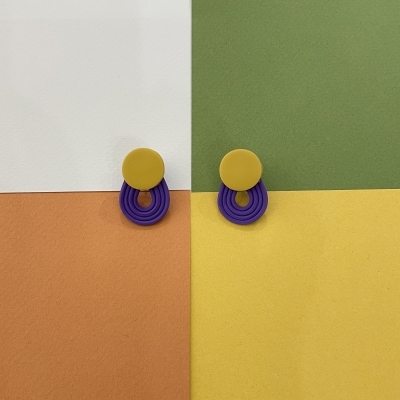 Polymer clay earrings with yellow little circle with purple stripes
