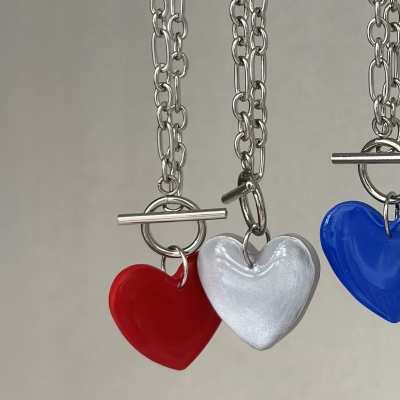 Handmade necklace with stainless steel chain and polymer clay silver color shiny heart motif 
